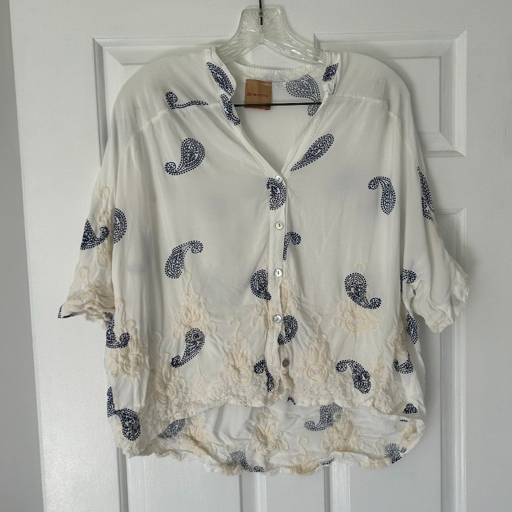 White blouse with blue pattern